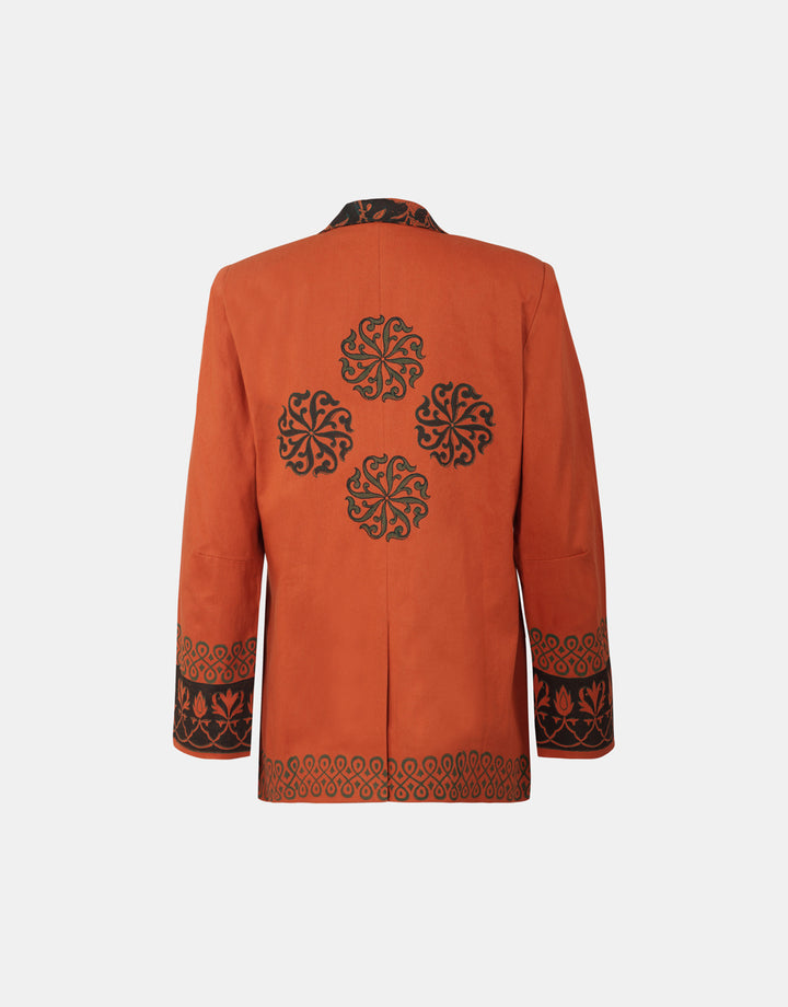 Nesavaali's Rust Oversized Double-Breasted Blazer, perfect for adding an ethical fashion statement to any outfit