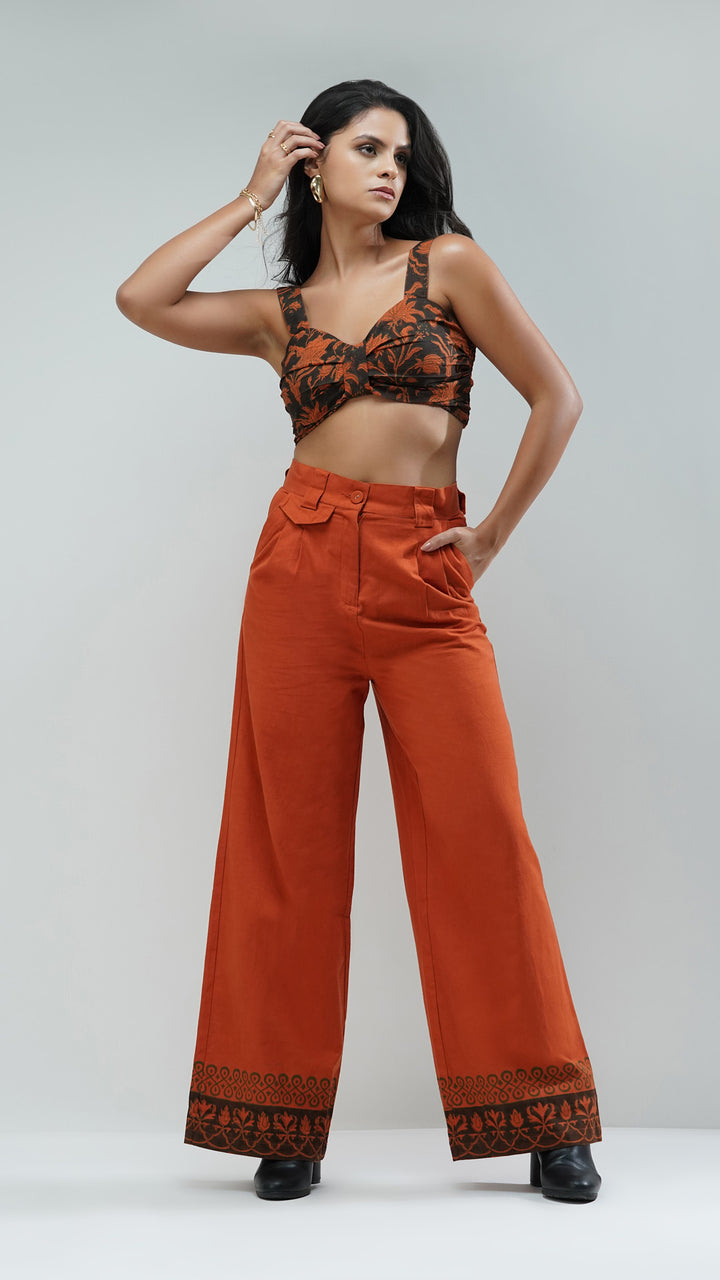 Front full view of the Rust Wide Leg Printed Trousers by Nesavaali, showcasing the relaxed designer fit.