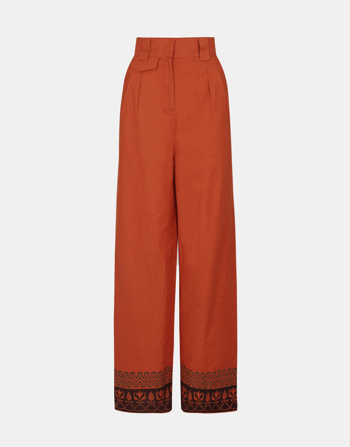 Rust Wide Leg Printed Trousers, highlighting the hand-block printed border detail.