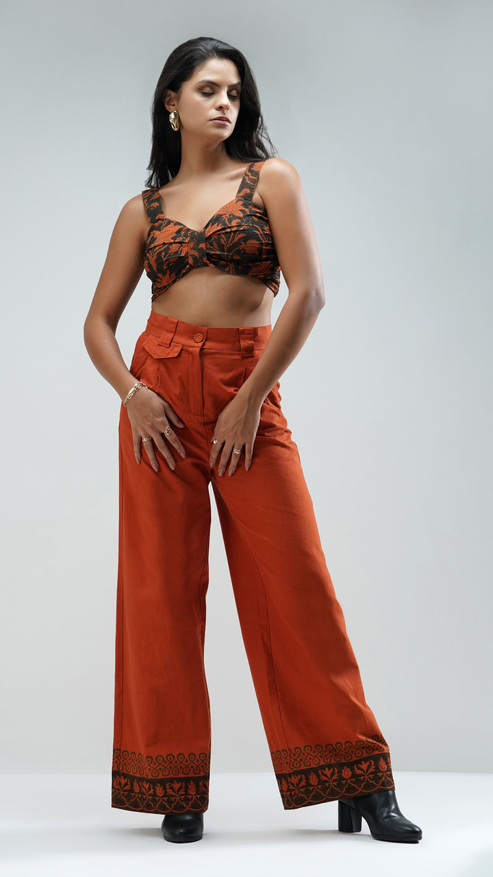 Nesavaali's Rust Wide Leg Printed Trousers, featuring the premium cotton fabric and artisanal details.