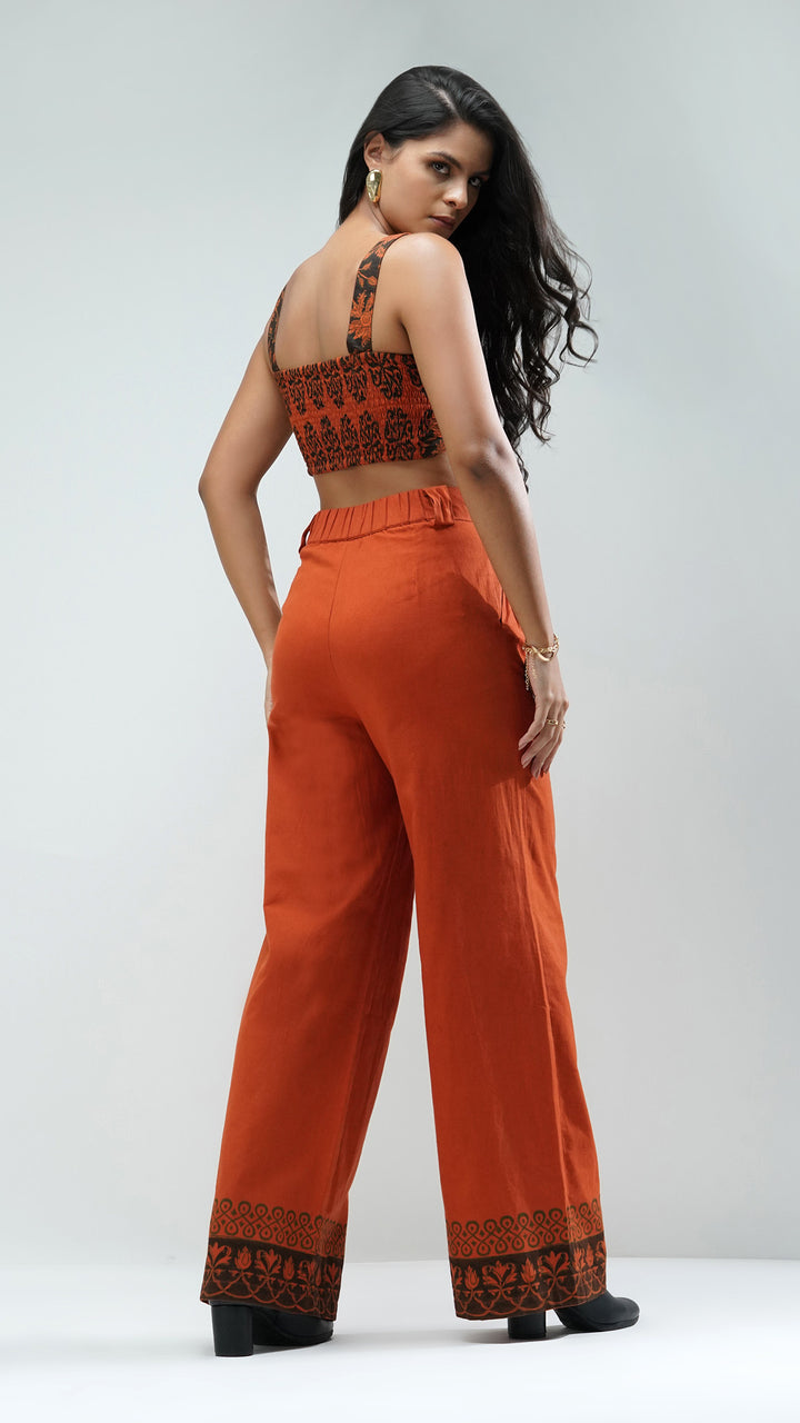 Nesavaali's Rust Wide Leg Printed Trousers, displaying the elegant silhouette suitable for casual or office wear.