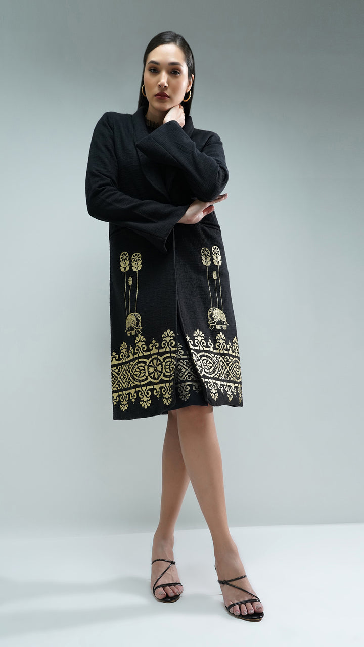 FW24 Nesavaali Black Metallic Artisanal Long Coat, emphasizing its relaxed fit and chic silhouette.