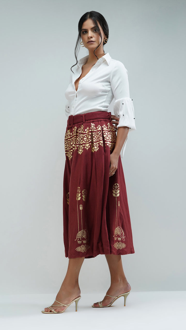 Artisanal Rust Metallic Gold Midi Printed Skirt, emphasizing its elegant movement.