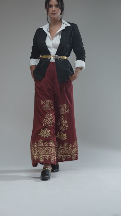 Women's Nesavaali London Metallic Printed Wide Leg Trousers, illustrating their comfortable fit and luxurious fabric.